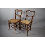 A Pair of Late 19th Century Cane Seated Balloon Back Bedroom Side Chairs