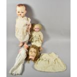 A Collection of Three Vintage Bisque Head and Plastic Dolls, Together with a Composition Dolls Head