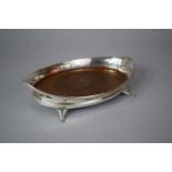 A Pierced Silver Boat Shaped Dish with Four Scrolled Feet and Inlaid Wooden Base, Chester