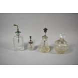 Three Silver and Enamelled Perfume Atomisers and a Silver Mounted Glass Scent Bottle