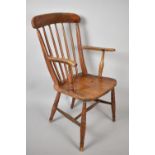 A Late 19th Century Elm Seated Spindle Backed Kitchen Armchair