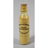 A Novelty Souvenir Miniature Glass Bottle Containing "Genuine Gold Mine Dust from Johannesburg,