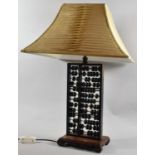 A Novelty Table Lamp Formed From a Chinese Abacus on Plinth Base and Scrolled Feet, 37cm high