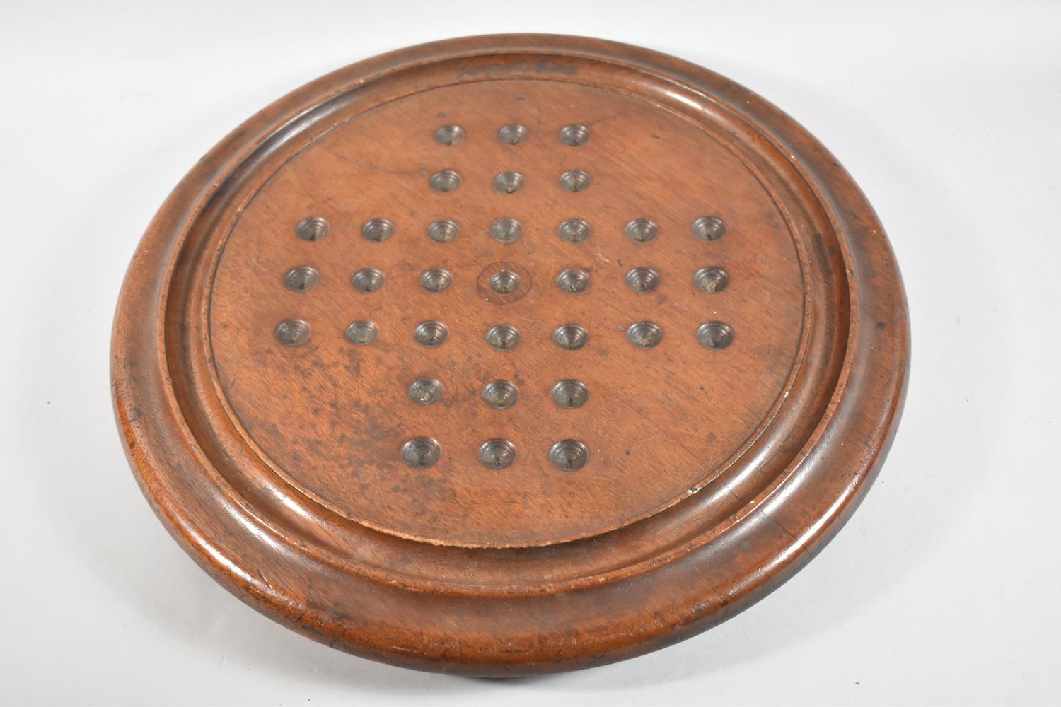 A Large Victorian Circular Mahogany Solitaire Board, 41.5cm Diameter