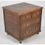 A 19th Century Oak Lift Top Box in the Form of a Chest of Two Short and Two Long Drawers, 46cm wide