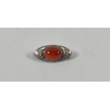 A Silver and Carnelian Arts and Crafts Style Oval Brooch