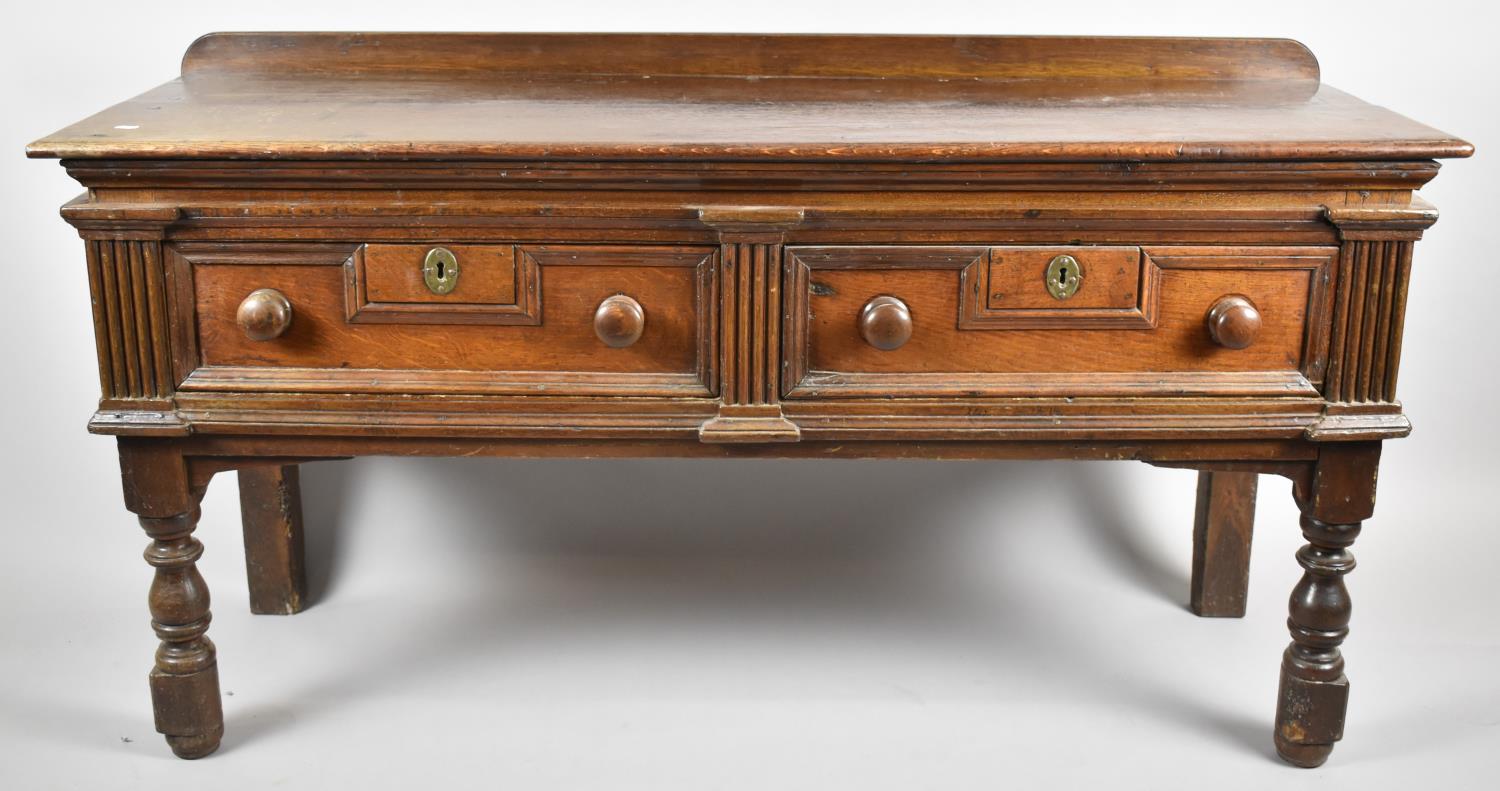 A Cut Down 19th Century Two Drawer Buffet with Galleried Top, Fielded Drawer Fronts and Turned