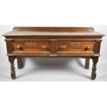 A Cut Down 19th Century Two Drawer Buffet with Galleried Top, Fielded Drawer Fronts and Turned