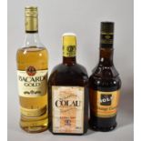 A Bottle of Bacardi Gold Rum, Kolau Orange Liqueur and Orange Curacao