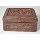 An Intricately Carved Chinese Wooden Box with Hinged Lid Having Carved Centre Panel Depicting