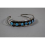 A Navajo Silver and Turquoise Bracelet, Stamped H