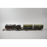 A Collection of Three Rail O Gauge Track, Two Marklin Tinplate Carriages and a Clockwork