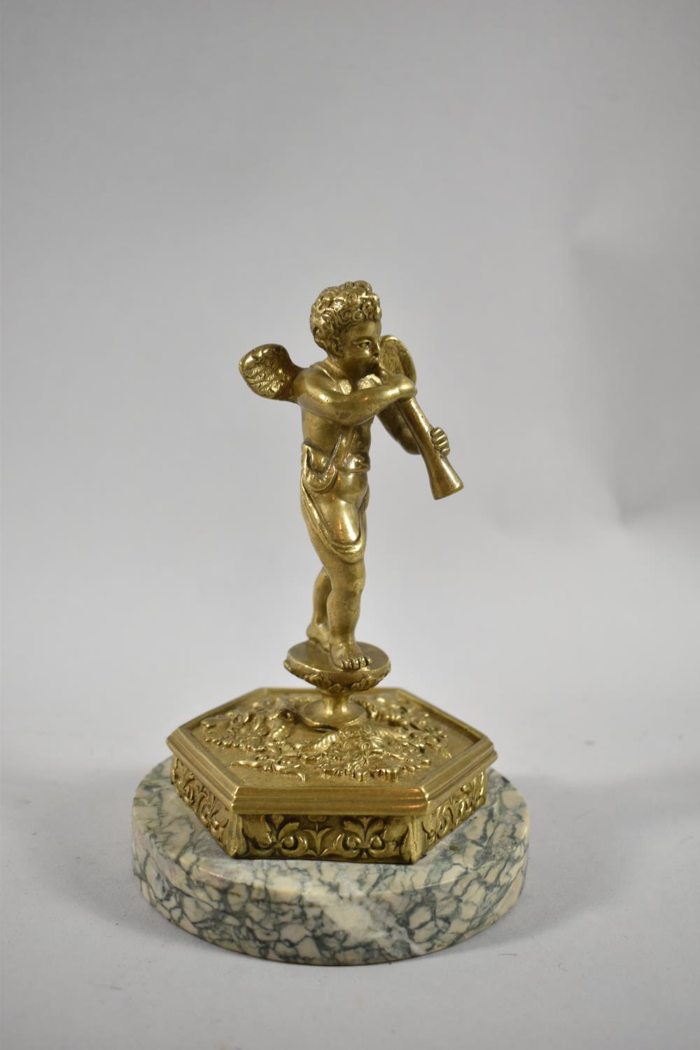 A French Gilt Bronze Study of Cherub Playing Horn on Circular Marble Base, 17.5cm high