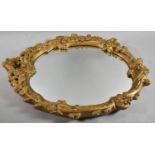 An Ornate gilt Framed Wall Mirror, 61cm High