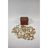 A Wooden Box Containing Various Coins