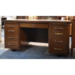 An Edwardian Oak Kneehole Writing Desk, 153cm wide