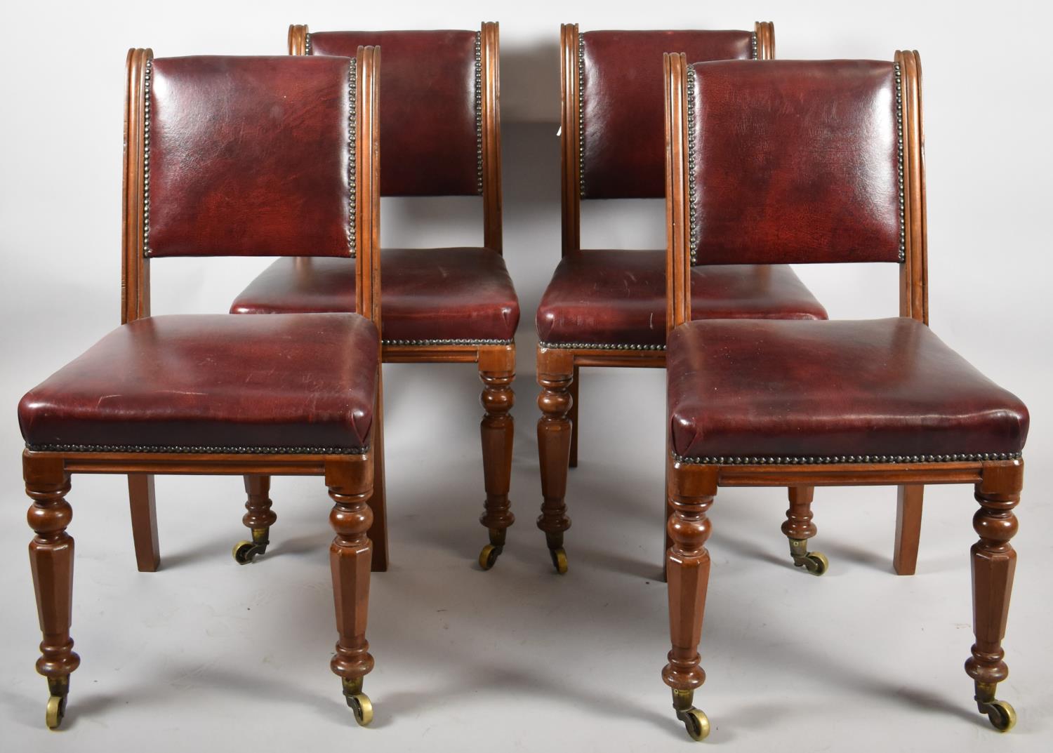 A Set of Four Hide Upholstered Mahogany Framed Edwardian Dining Chairs