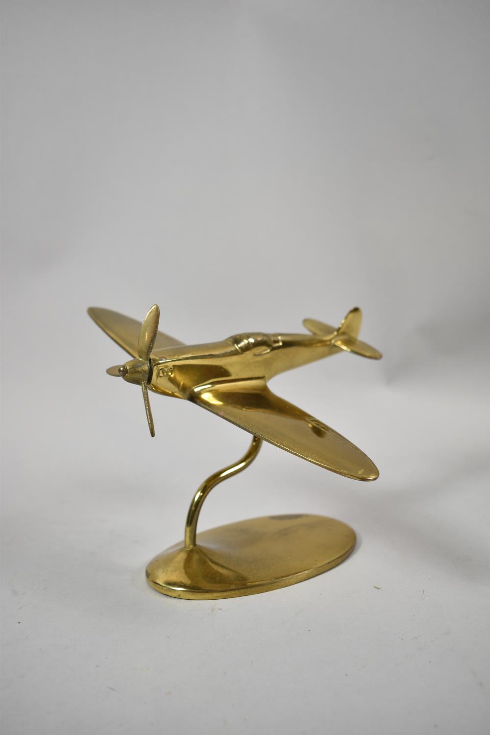 A Desk Top Brass Model of a Spitfire in Flight, 18cm Long