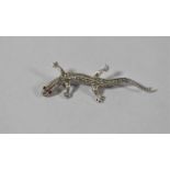 A Silver and Marcasite Lizard Brooch with Ruby Chip Eyes