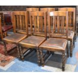 A Set of Six Edwardian Oak Framed Dining Chairs with Fleur De Lys Decoration to Top Rails