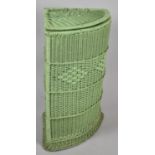 A Woven Corner Clothes Basket Painted Green