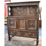 A 19th Century Court Cupboard with Two Base Drawers, Centre Inlaid Panel and Carved Three Panel