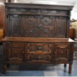 A Cut Down Oak Dresser Base with Two Centre Drawers and Two Cupboards Having Raised Panel Back