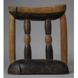 An African Headrest/Pillow with Turned Centre Supports, 19cm wide and 21cm high