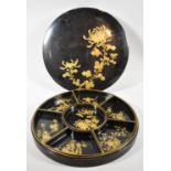 A Circular Lacquered Chinese Hors d'oeuvres Dish and Cover with Seven Removable Trays, Gilt