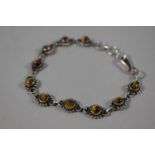 A Silver and Tiger's Eye Floral Style Bracelet