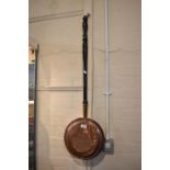 A Copper Bedwarming Pan on Turned Ebonised Handle