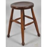 An Edwardian Circular Topped Stool, One Stretcher Require Re-gluing, 28cm Diameter and 46cm high