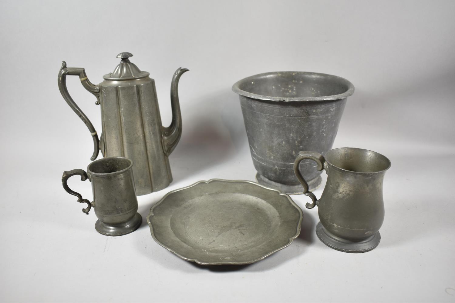 A Collection of Various 19th Century Pewter Items to Include Coffee Pot, Two Tankards, Planter and