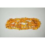 A Long String of Graduated Amber Chip Beads with Inclusions, 53.7g