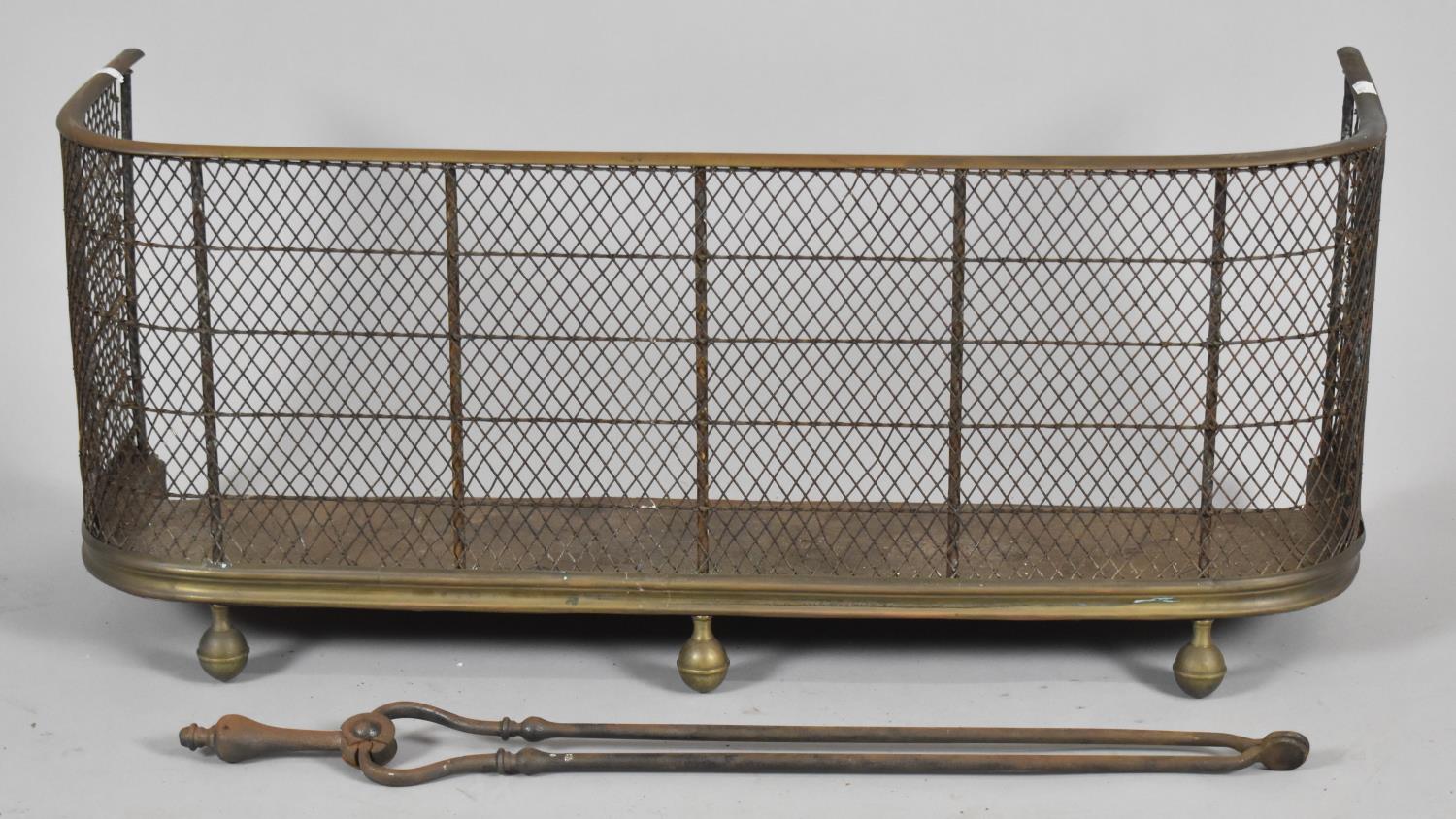 A Brass Mounted Late Victorian Fire Kerb and Fire Iron, 86cm wide