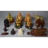 A Collection of Resin and Brass Buddhas, Carved African Elephants and Mask