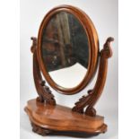 A Late Victorian Mahogany Oval Dressing Table Mirror on Plinth Base, 48cm wide