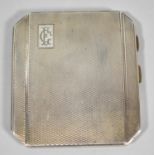 A Silver Cigarette Case with Engine Turned Decoration Monogrammed C E, Birmingham Hallmark