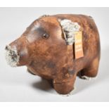 A Leather Effect Doorstop in the Form of a Pig, 32cm Long