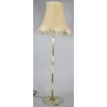 A Mid 20th Century Onyx and Brass Standard Lamp and Shade