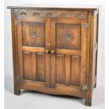 An Old Charm Style Cocktail Cabinet with Carved Top Rail and Panelled Doors to Mirrored Fitted