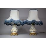 A Pair of Gilt Metal Ormolu Mounted Ceramic Table Lamps by Capodimonte, both with Shades