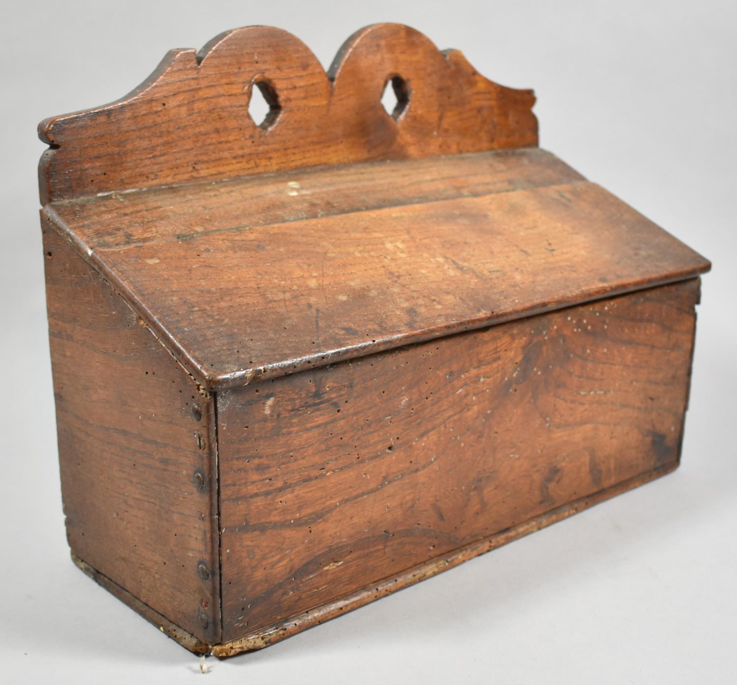 An Early 19th Century Oak Candle Box with Shaped Pierced Crest and Hinged Sloping Lid, 36cm wide