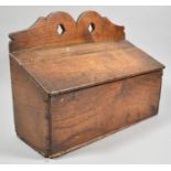 An Early 19th Century Oak Candle Box with Shaped Pierced Crest and Hinged Sloping Lid, 36cm wide