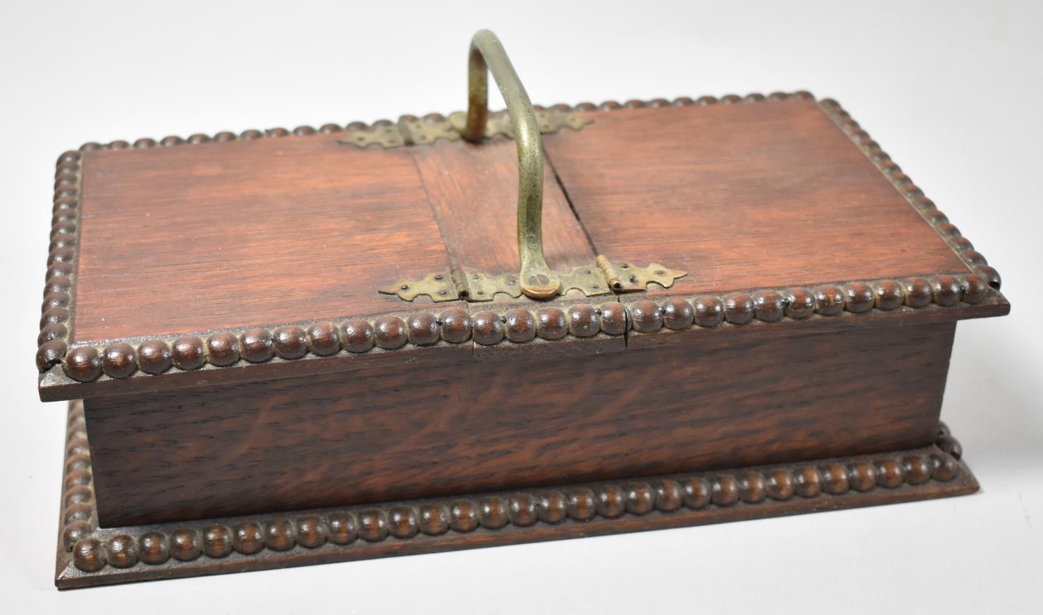 An Edwardian Oak Twin Cigarette Box with Silver Plated Carrying Handle and Gadrooned Borders, 25cm