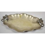 A Silver Plated Lobed Tray, the Handles in the Form of Cherubs Holding Laurel Wreaths, 36cm wide