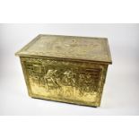 A Mid 20th Century Brass Slipper Box Decorated with Tavern Scenes in Relief, 46cm Wide