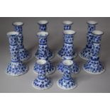 A Collection of Eight Blue and White Ceramic Candlesticks together with Two Smaller Examples.