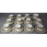 A Coalport Floral Decorated Teaset to comprise 11 Cups, 12 Saucers, 12 Side Plates, Milk, Sugar