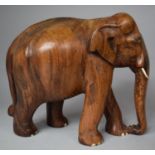 A Carved Wooden Study of an Elephant, 26cm high